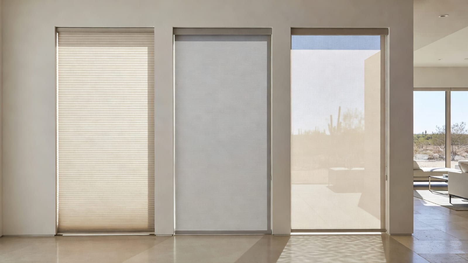 Three large windows showing different shade fabrics and light-filtering effects.